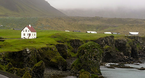 House on a cliff with cables